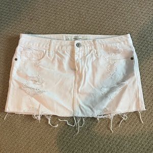 Distressed denim mini skirt